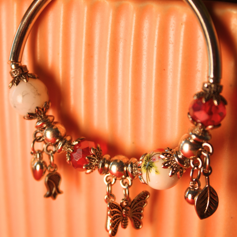 Red and White Beaded Bracelet with Butterfly and Leaf Charms - Handmade Bohemian Jewelry