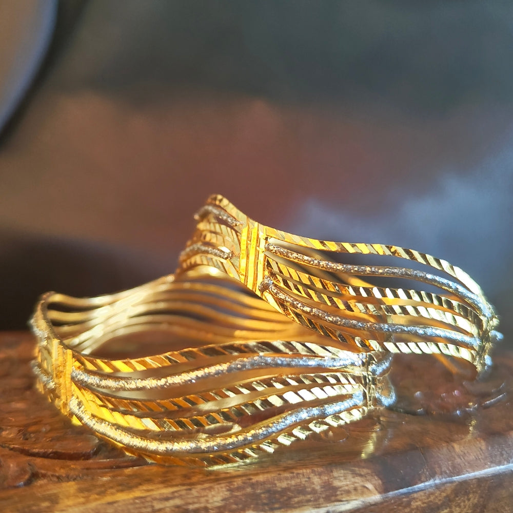 Gold-Plated Wavy Bangles with Intricate Detailing and Sparkling Accents for Elegant Occasions